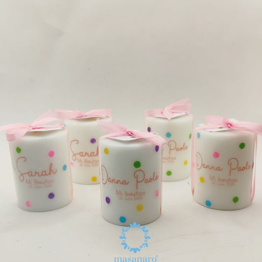 Vela con diseño puntos colores