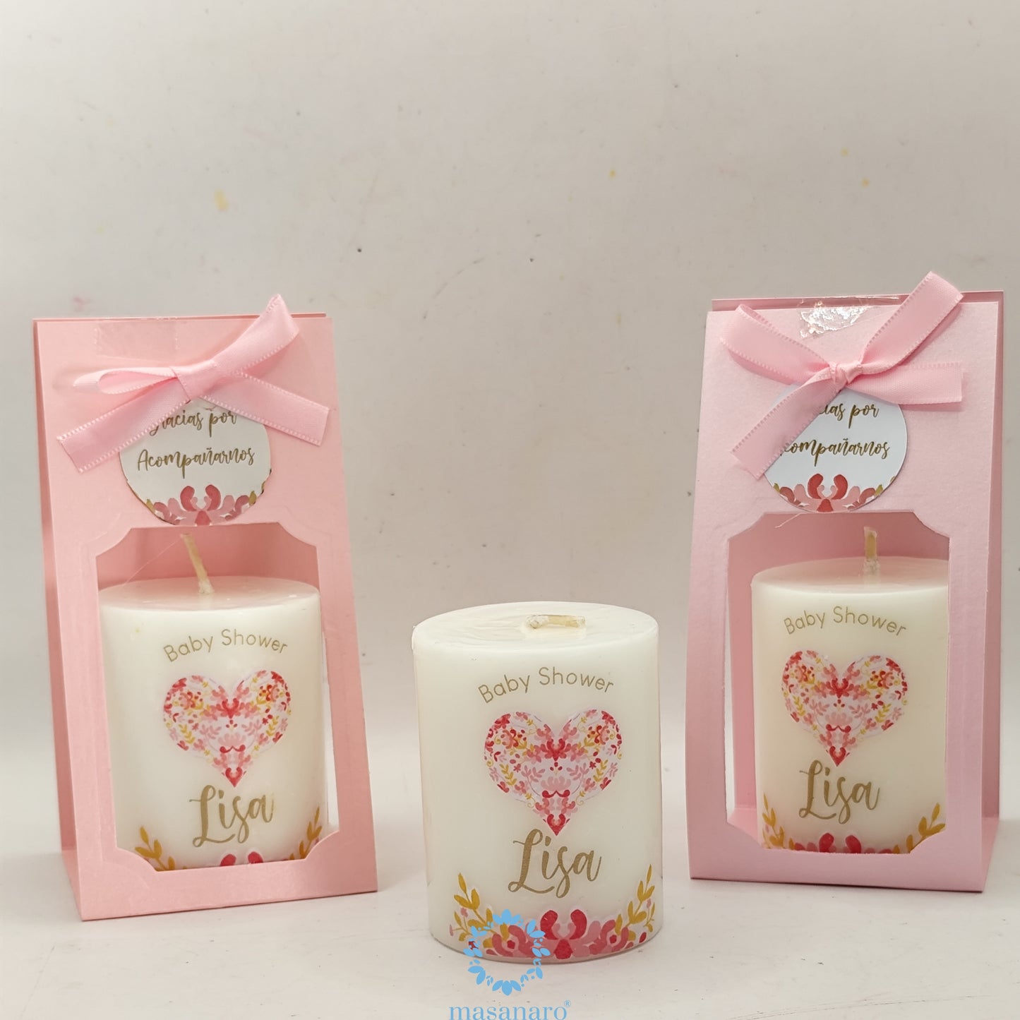 Vela con empaque de cartón. Diseño, corazón rosa