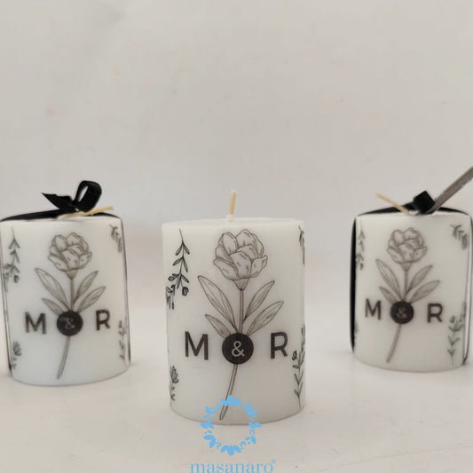 Vela con diseño floral negro